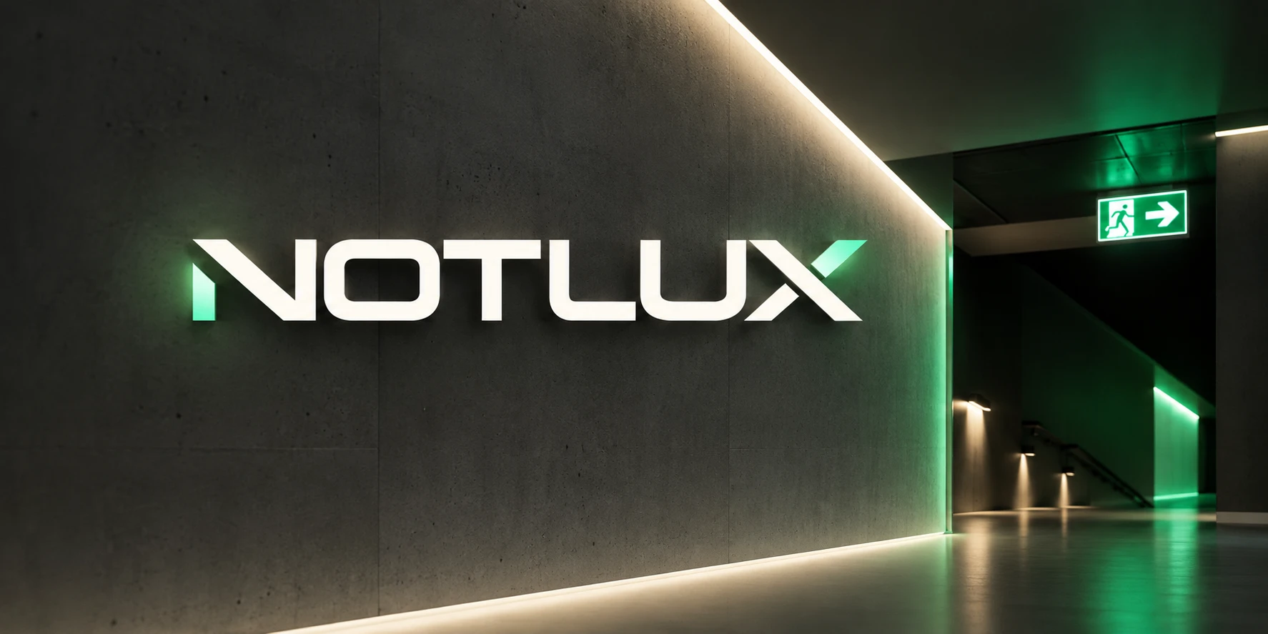 NOTLUX logo on a concrete wall with a green exit sign in the corridor
